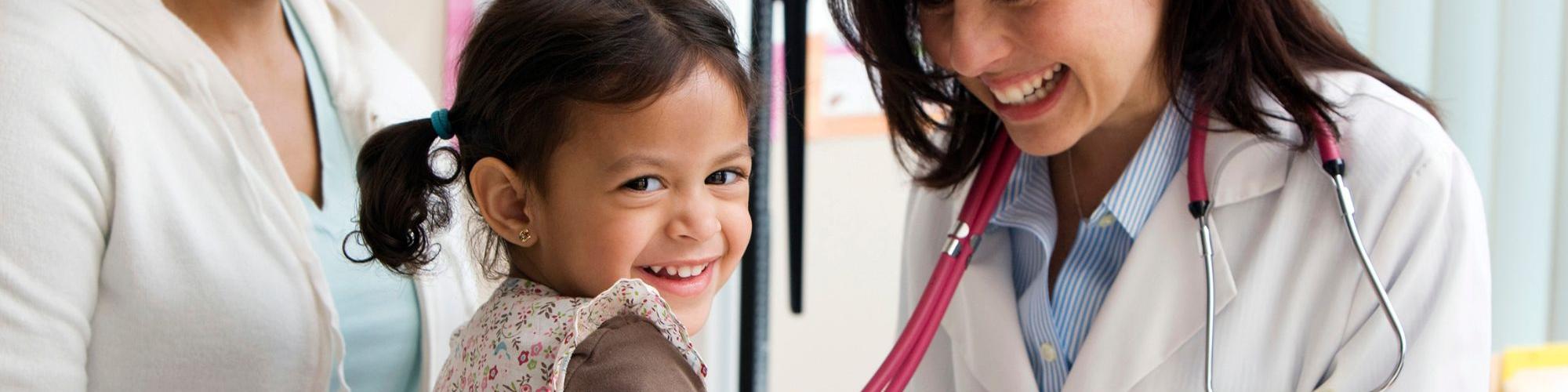 Child with mom and medical provider